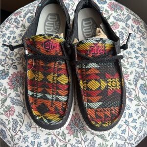 Hey Dude women’s Moccasins with Red and Yellow Pattern